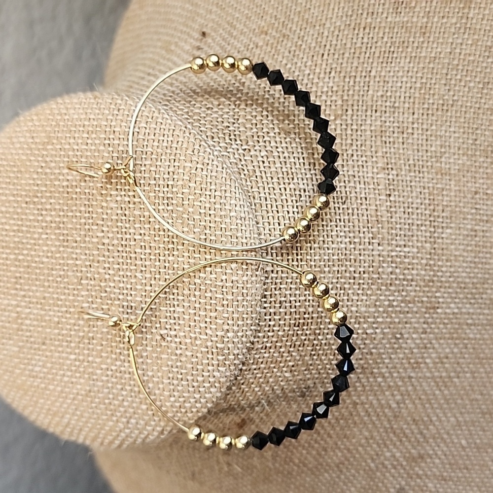 Custom gold tone and black closed hoop earrings